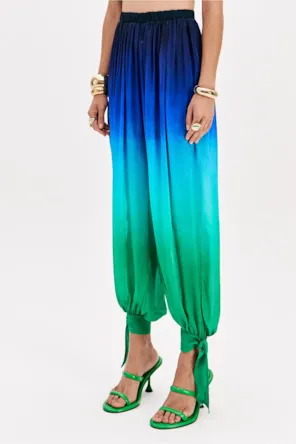 CALÇAS FLUIDAS ESTAMPA LANÇA PERFUME 